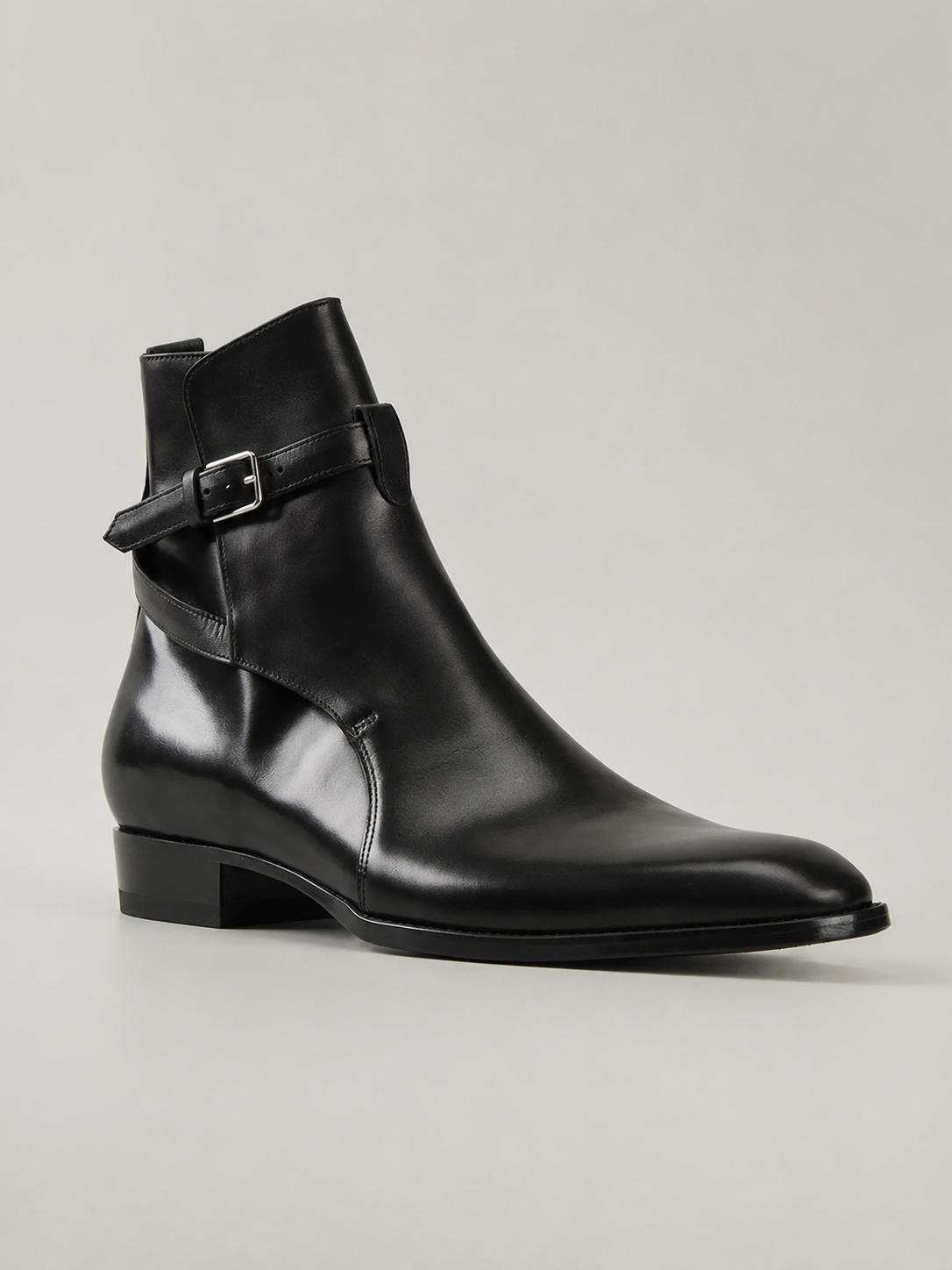Luxury black leather Jodhpur boots for men featuring a silver buckle strap, sleek almond toe, and premium formal boot design.