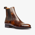 Brown leather Chelsea boot on a white background